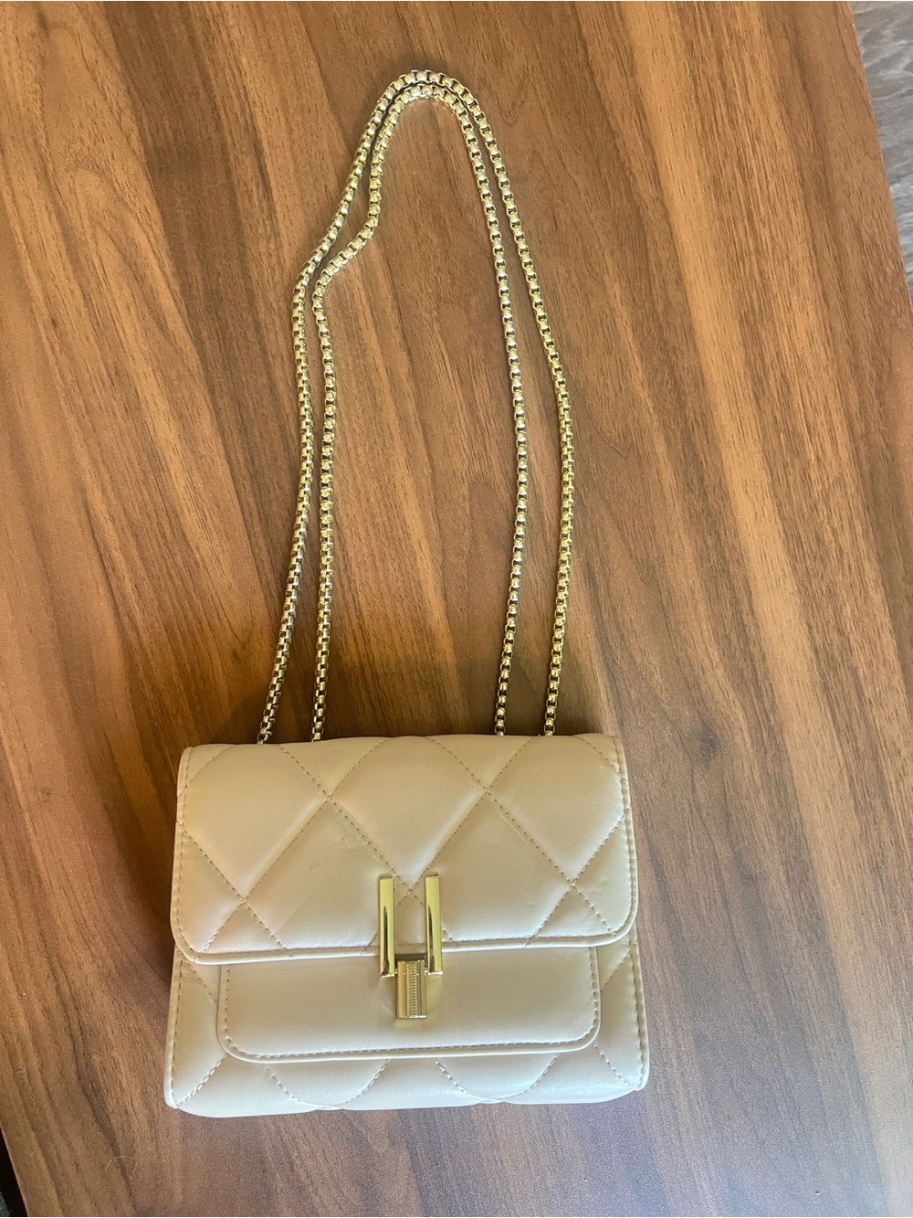 Small Apricot Quilted Crossbody Bag
with Gold Hardware